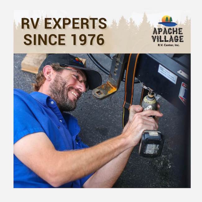 RV Technician Performing Service