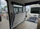 Interior view with sofa in transport mode and rear ramp patio