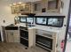 kitchen view with oven and fireplace
