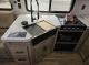 Rear kitchen countertop and appliances in the Grey Wolf 26SS
