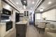 Kitchen island, dining area, and living room in 2027 Cherokee Sabre 32RL fifth wheel