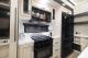 Kitchen stove, oven, and microwave in 2027 Cherokee Sabre 32RL