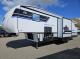Campside exterior with dual awnings on the Arctic Wolf 331BH