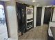 Entertainment wall and entry area in 2027 Grey Wolf 27GH
