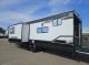 Rear driver-side exterior with slide-outs and patio on 2027 Cherokee Wolf Pack 365Pack15.5