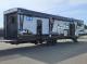 Passenger-side exterior with entry doors and awnings on 2027 Cherokee Wolf Pack 365Pack15.5
