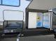 Exterior kitchen with griddle and refrigerator on 2027 Cherokee Wolf Pack 365Pack15.5