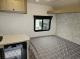 Flagstaff E Pro 131BLE bed and window interior view