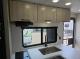 2027 Forest River Acclaim 26RB kitchen cabinets, sink, and window