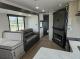 2027 Forest River Acclaim 26RB living room with sofa, dinette, and fireplace