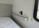 2027 Forest River Acclaim 26RB bedroom bedside shelf and outlets
