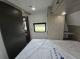 2027 Forest River Acclaim 26RB bedroom wardrobe, cabinet, and window