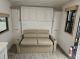 Sofa in front living area of 2027 Longitude 160MRBLE