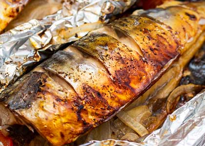Photo of fish that has been cooked on campfire