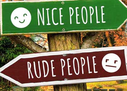 Photo of sign at campground with words rude people, nice people and directional arrows.