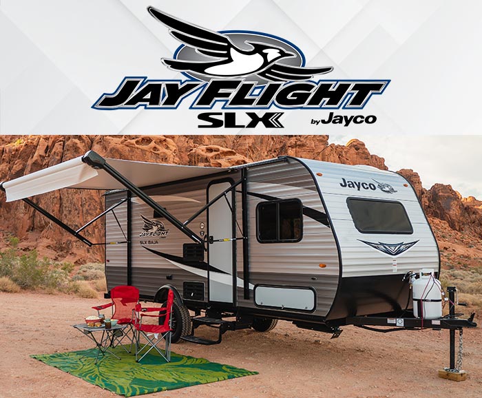 Photo of Jay Flight SLX travel trailer in the desert with logo above.