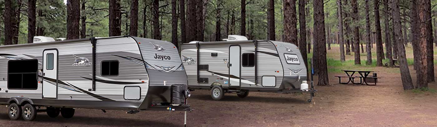 Photo of Jayco Jay Flight travel trailers at a campsite.