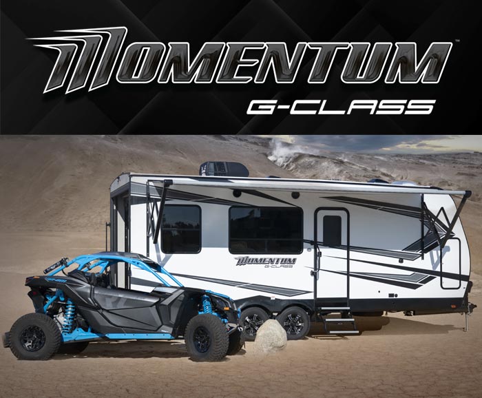 Photo of Momentum G-Class travel trailer toy hauler with logo above.
