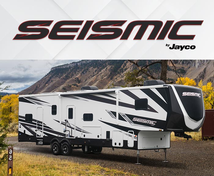 Photo of Jayco Seismic toy hauler with logo above. 