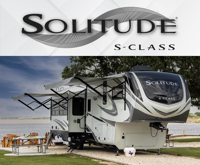 Photo of Solitude S-Class fifth wheel parked by beach and logo above.