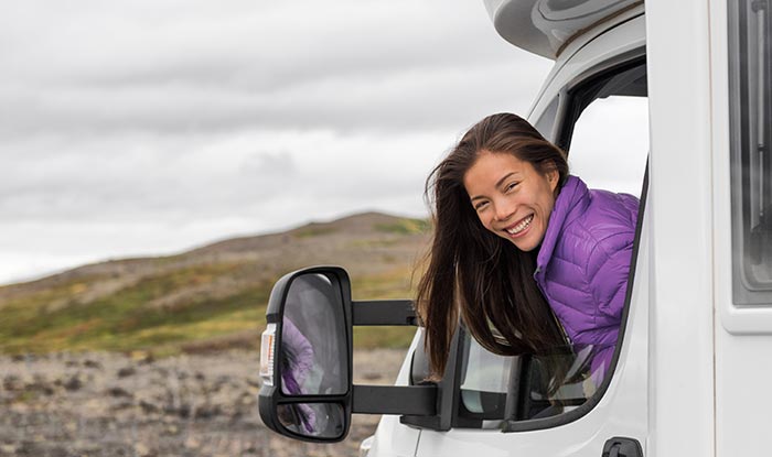 Photo of a happy woman in new RV.